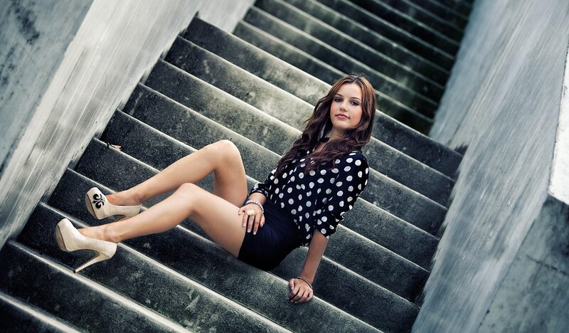 woman in polka dot dress on stairs