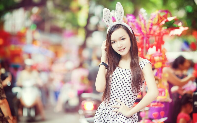 woman in polka dot dress with bunny ears