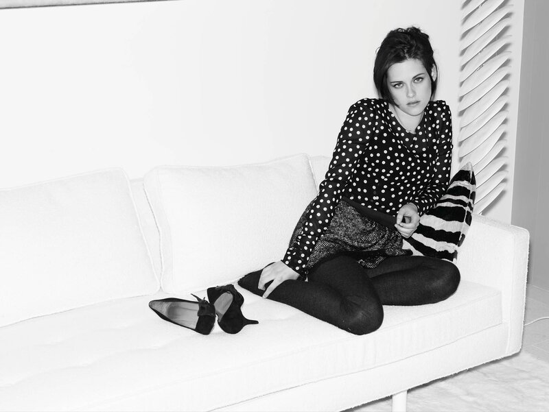 woman in polka dot shirt on couch