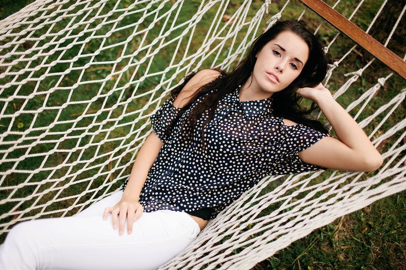 woman in polka dot shirt on hammock