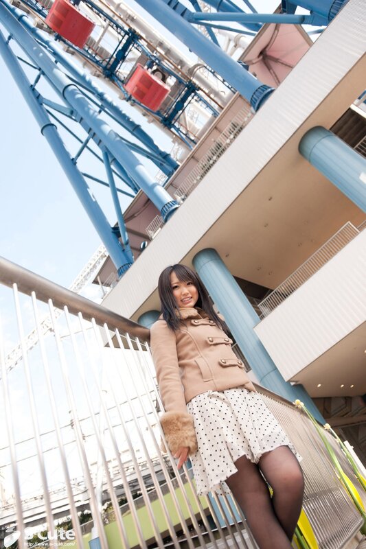 Woman in polka dot skirt at amusement park
