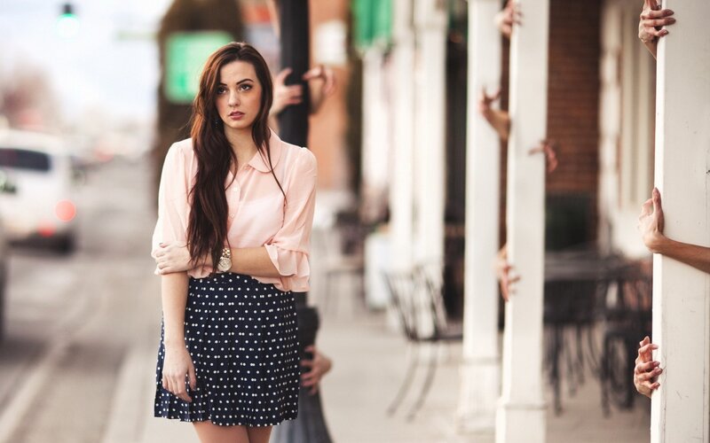 woman in polka dot skirt on street