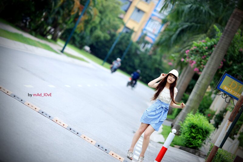 Woman in polka-dot skirt on street
