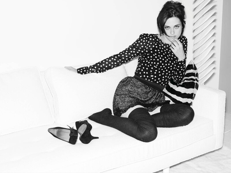 woman in polka dot top on couch