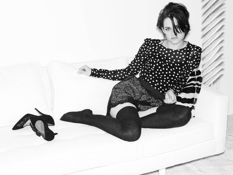 woman in polka dot top on couch
