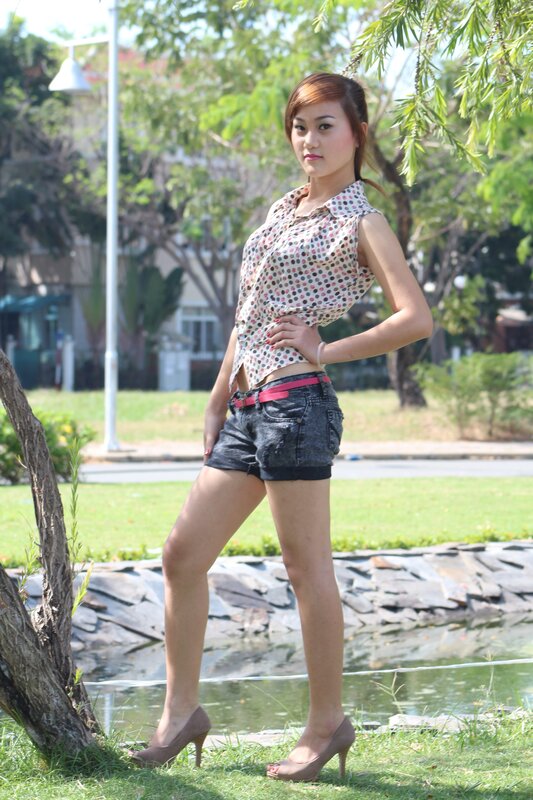 Woman in polka-dot top outdoors