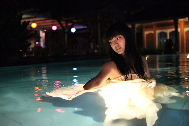 woman in pool at night
