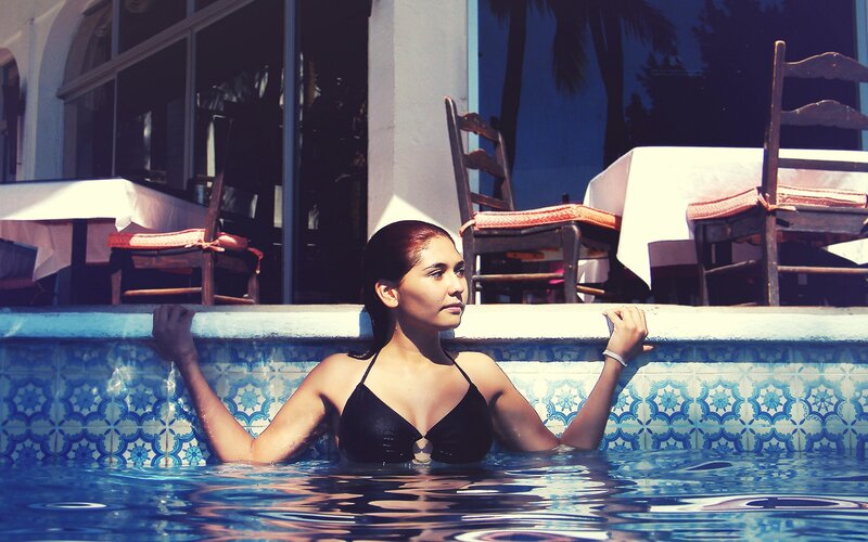 woman in pool at resort