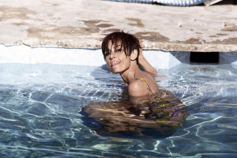 woman in pool at resort