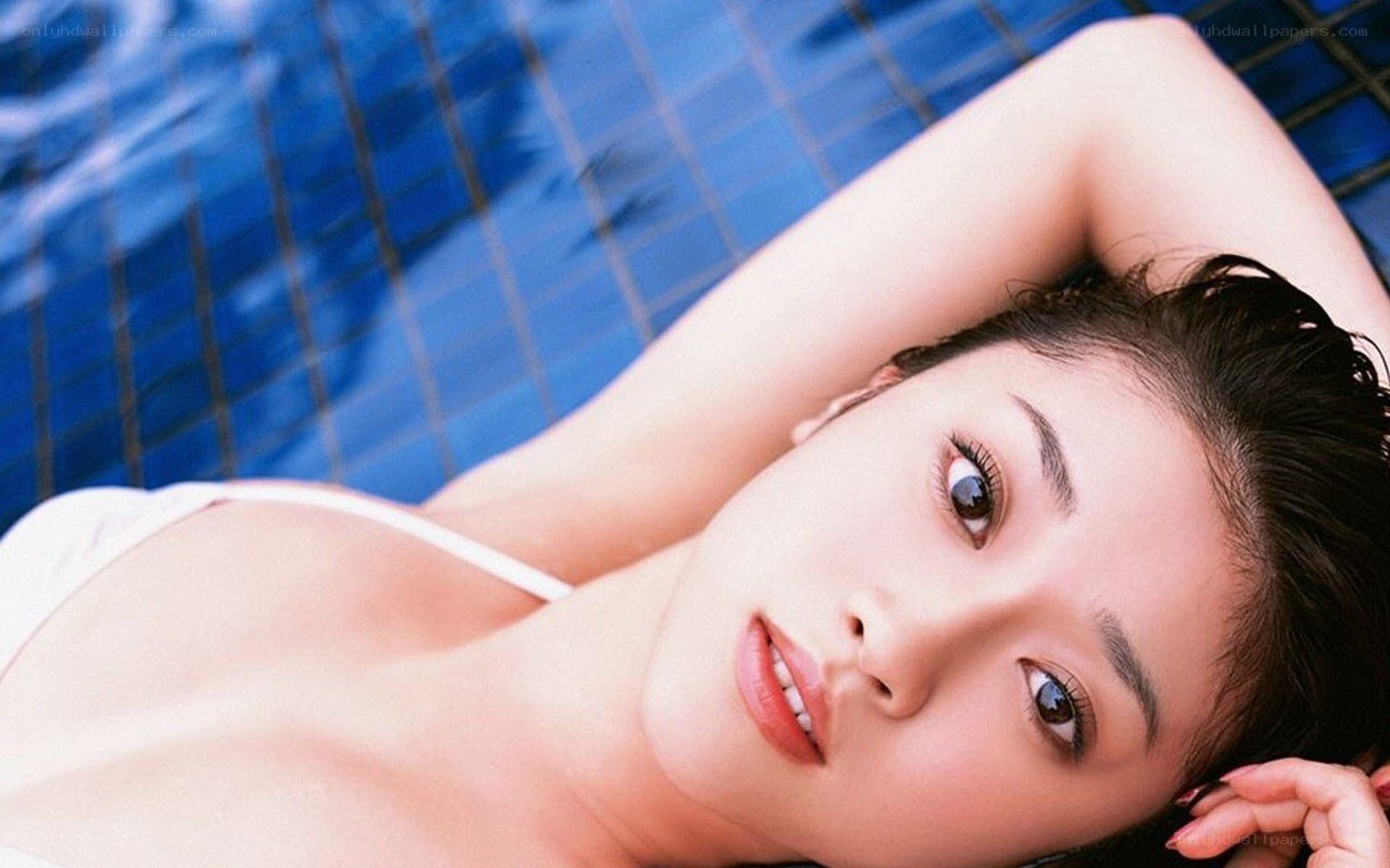 woman in pool looking at camera