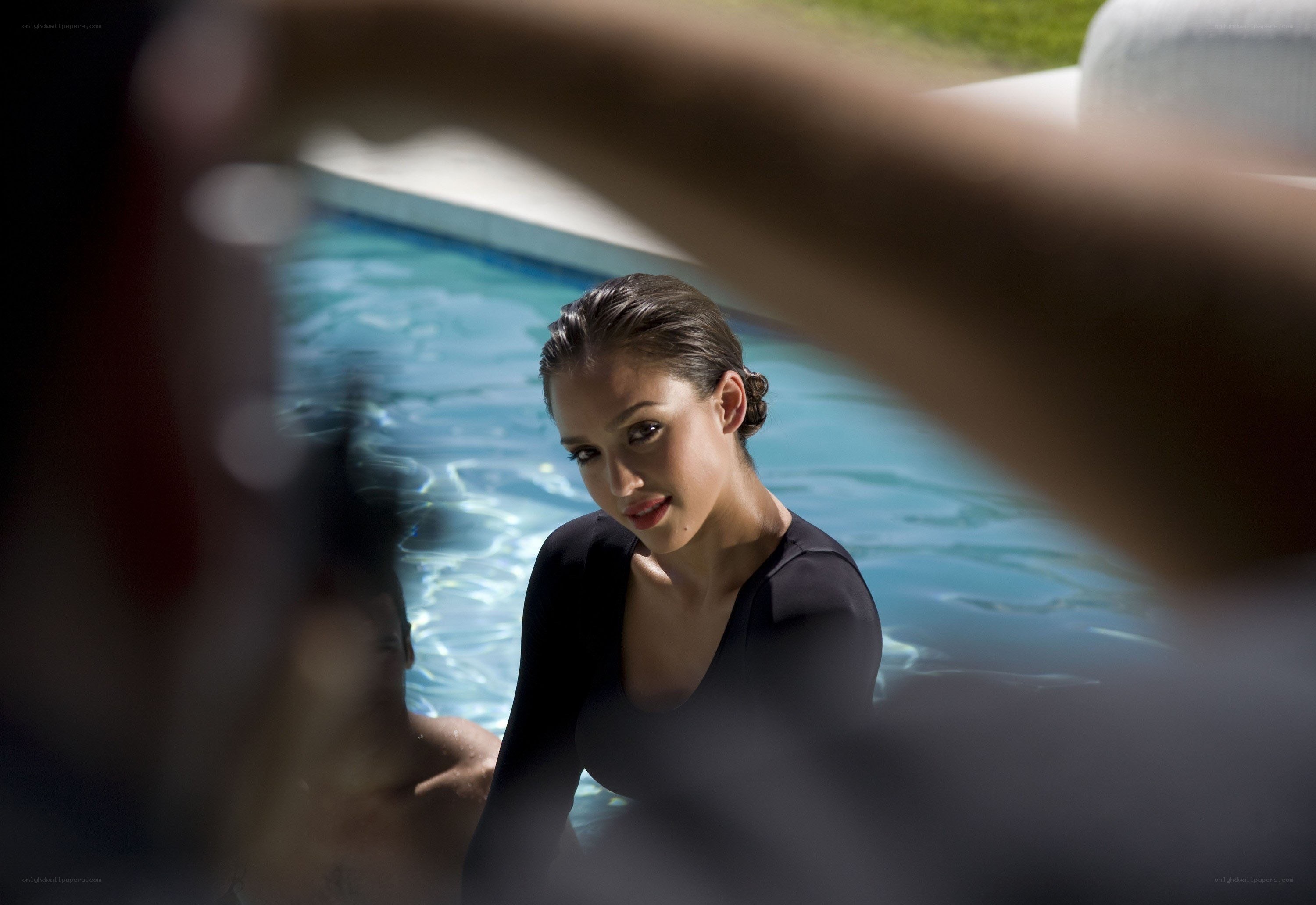 woman in pool looking at camera