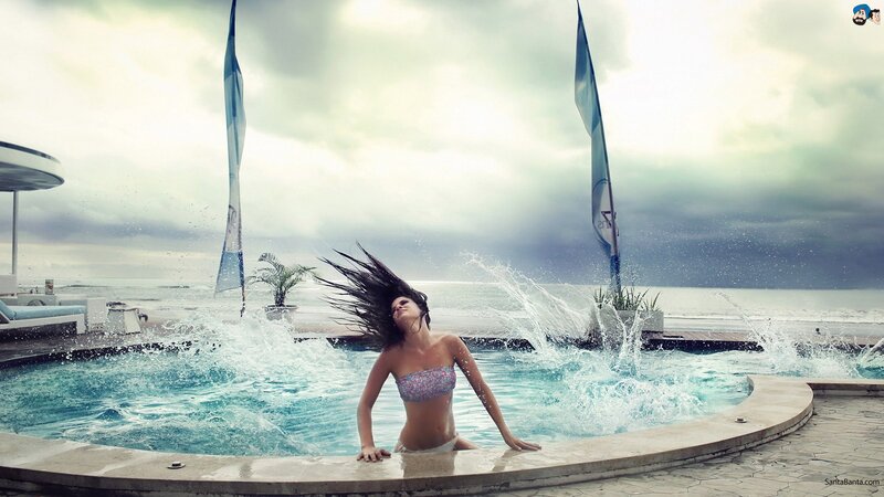 Woman in Pool Splashing Water — Blue, Dramatic