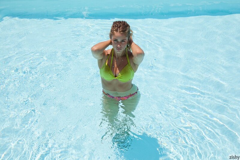 Woman in pool wearing bikini