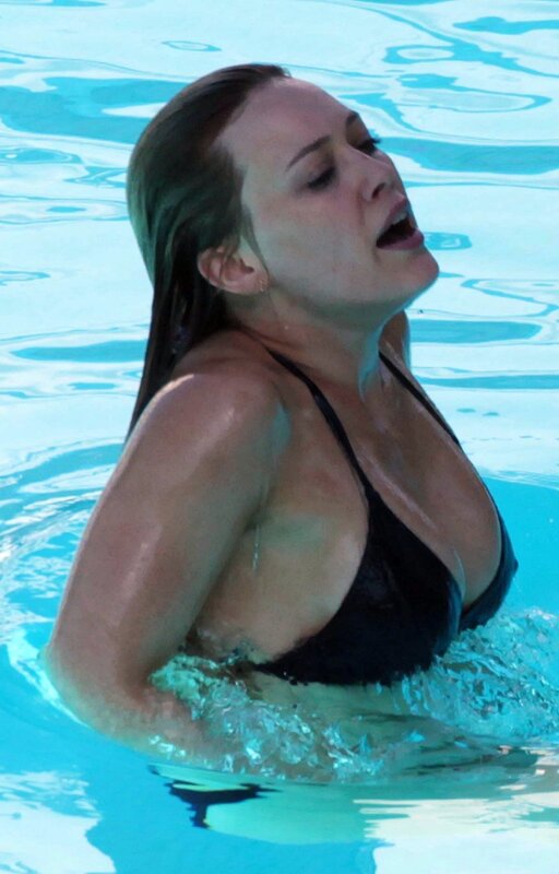 woman in pool wearing swimsuit