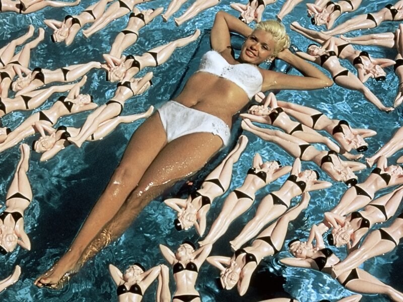 Woman in Pool with Dolls