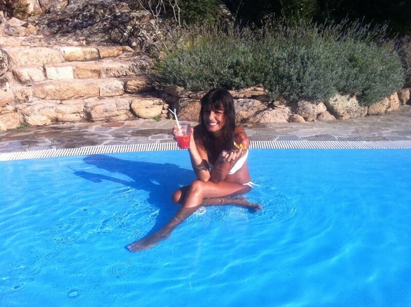 Woman in pool with drink