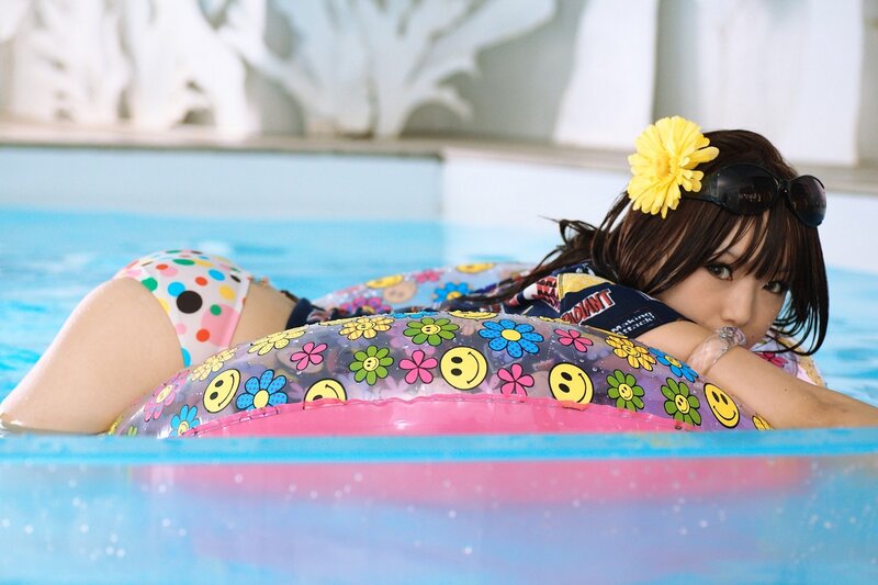 Woman in Pool with Floatie — Blue