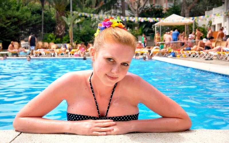 woman in pool with flower crown