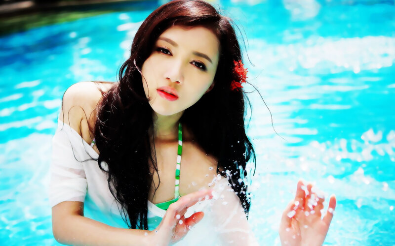 woman in pool with flower