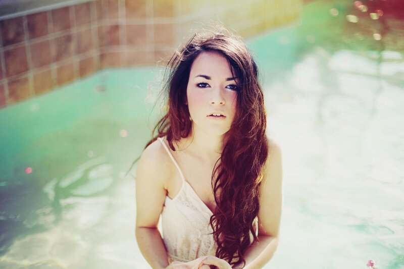 woman in pool with long hair