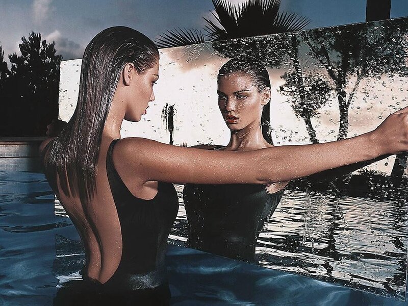 woman in pool with mirror