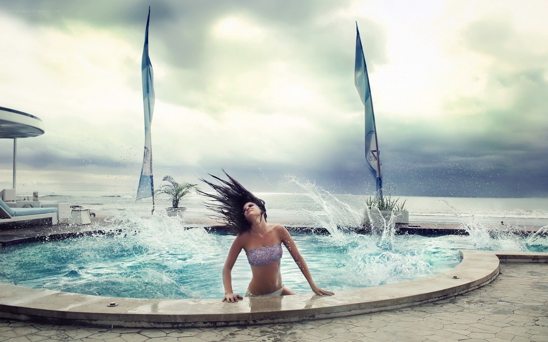 woman in pool with ocean view