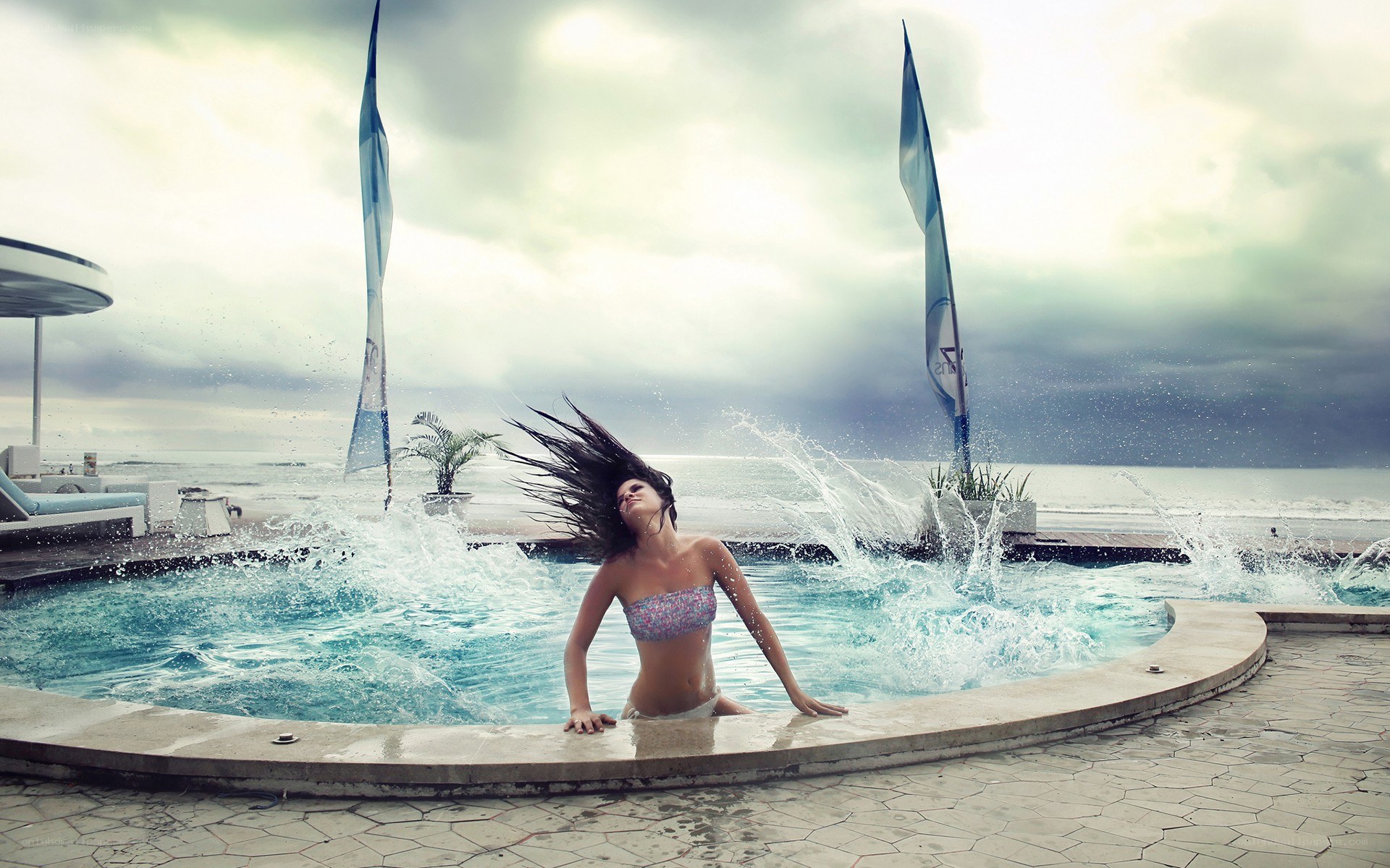 woman in pool with ocean view