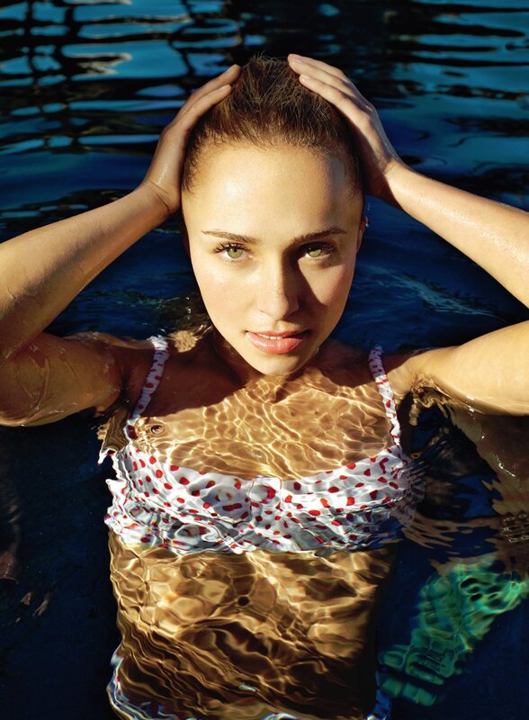 woman in pool with polka dot swimsuit
