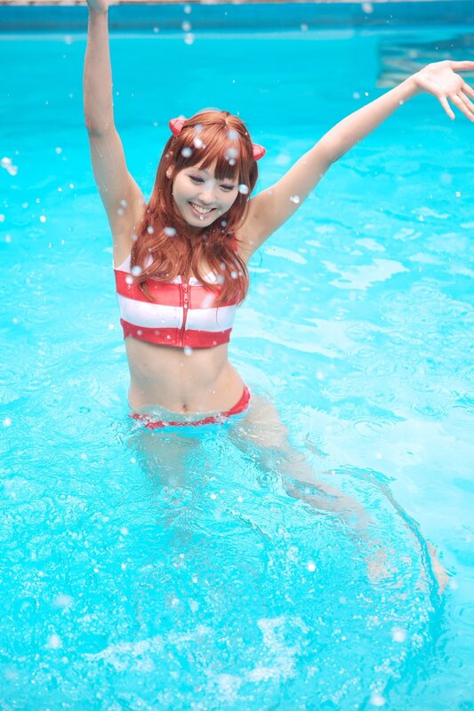 woman in pool with red swimsuit