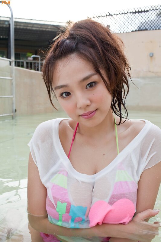 woman in pool with sheer cover-up