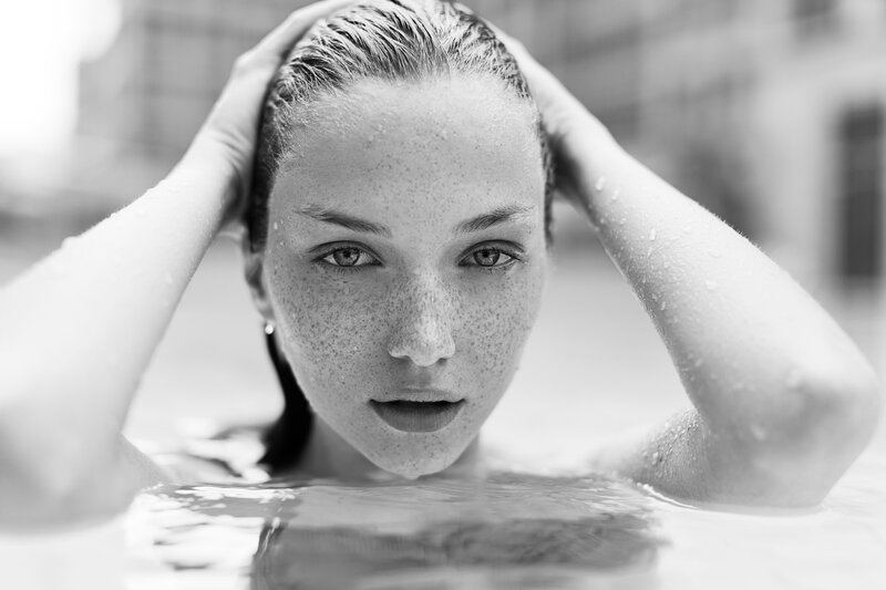 woman in pool with wet hair
