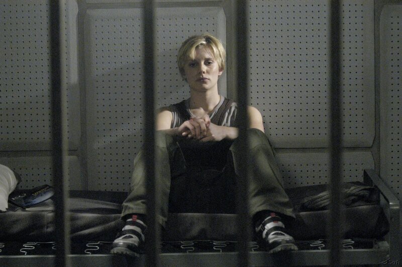 Woman in Prison Cell — Gray