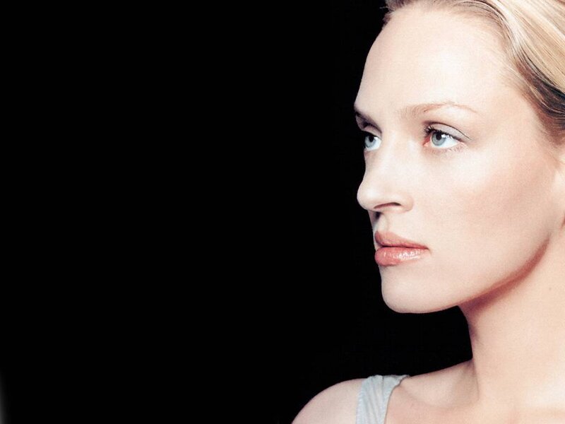 woman in profile against black