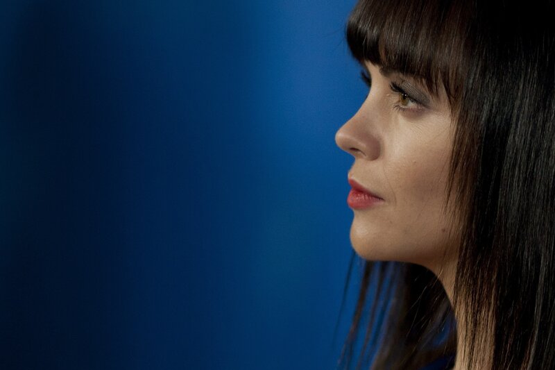 woman in profile against blue background