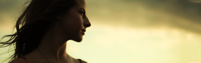woman in profile at sunset