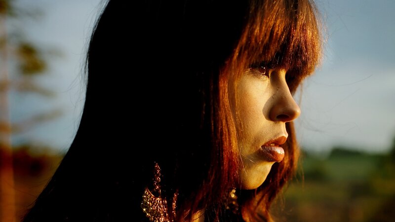 woman in profile at sunset