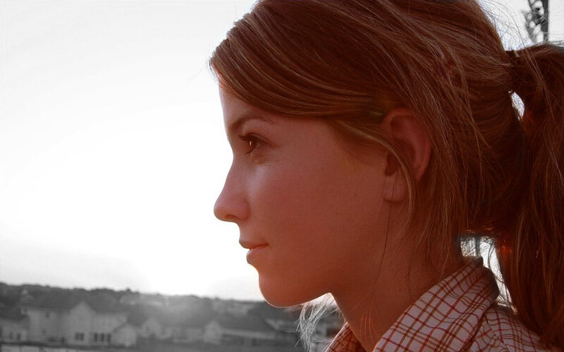 woman in profile at sunset