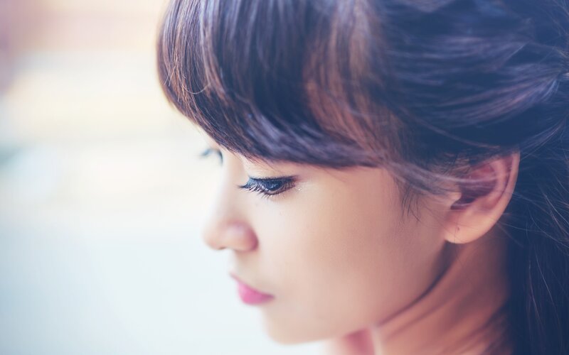 woman in profile looking away
