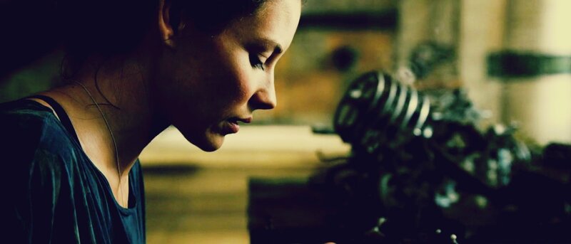 woman in profile looking down