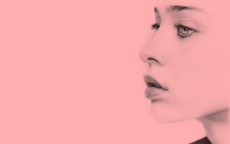 woman in profile on pink background