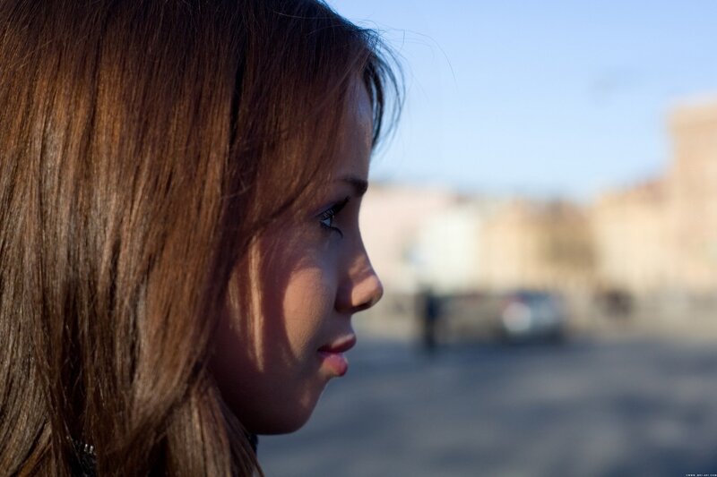 woman in profile on street