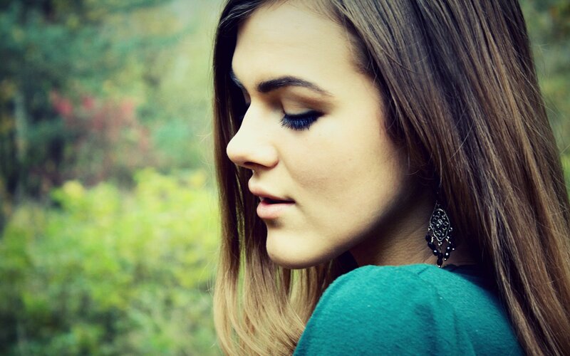 woman in profile outdoors
