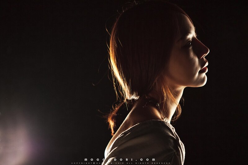 woman in profile with backlighting