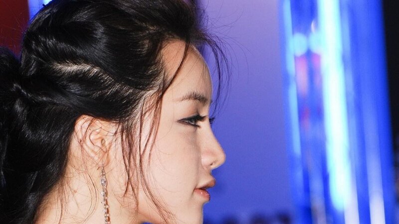 woman in profile with blue lights