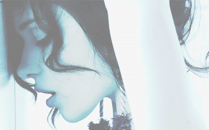 woman in profile with blue tint