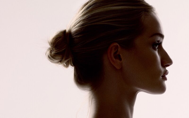 woman in profile with bun
