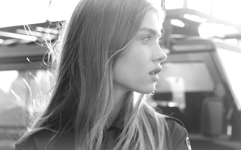 woman in profile with car