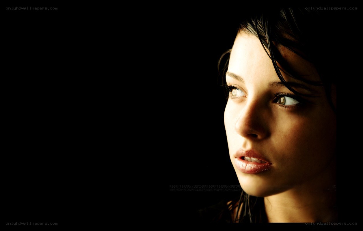 woman in profile with dramatic lighting
