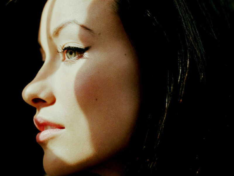 woman in profile with dramatic lighting