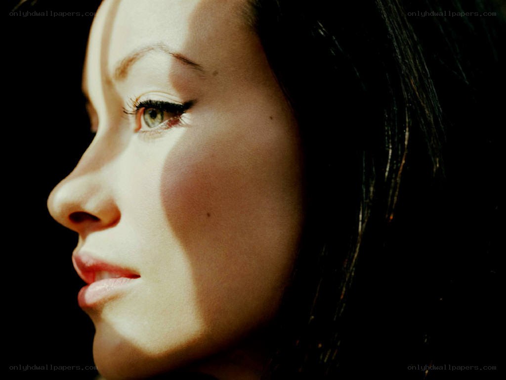 woman in profile with dramatic lighting